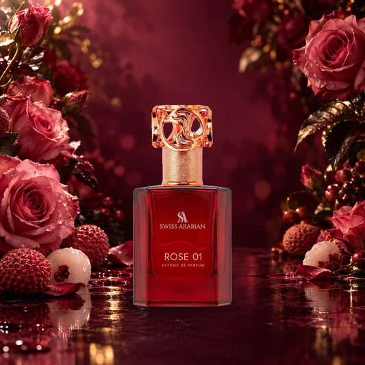 Swiss Arabian Rose 01 Extrait de Parfum red bottle with rose-gold cap among roses and lychees